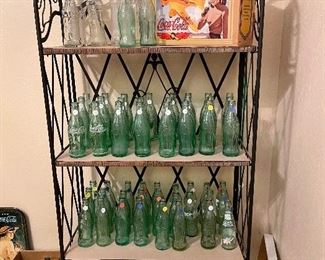 Coca-Cola Bottle Collection.  Those stickers are not price tags.  They are numbers for their collection 