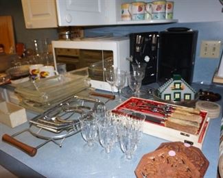 microwave, glassware,  carving set