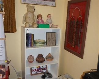 bookcase, dolls, pottery