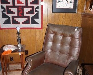 recliner, small side table, carpet, art