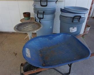 wheel barrow, trash cans, bird bath