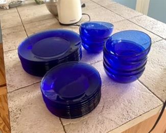 A set of cobalt blue plates and bowls.