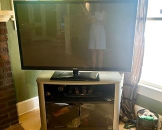 Samsung TV and entertainment stand.