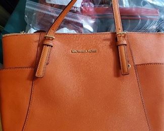Bright orange Michael Kors purse