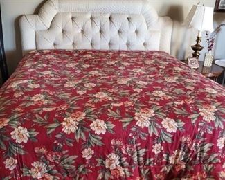 King size cream colored tufted bed with rails