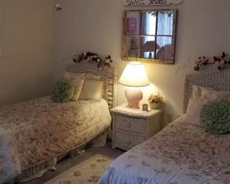 Pretty twin beds with wicker headboards