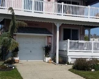 Garage door approx. 8' x 7'. Fixed canvas awning