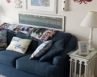Cozy navy couch; white end tables