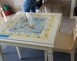 Hand-painted table with two chairs and glass top
