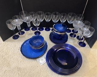 Blue plates , wine glasses, champagne flutes , bowls x7, plates 