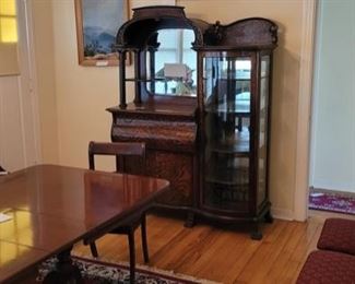 Rare Tiger Oak quarter sawn in the American Art Nouveau style.... dresser/desk with mirror , bonnet and curio.  A very stylish piece circa 1890's. A must see.