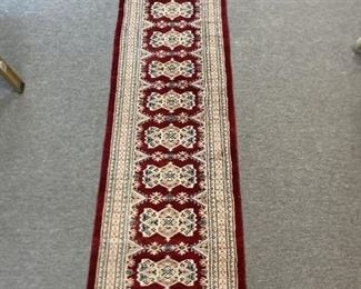48 - Bokhara HK Carpet Runner w/ Silk Highlights Bokhara hand knotted carpet runner with silk highlights. Strong true red, ivory with shades of blue and peach/pink. Standard rug size 2' x 9, note actual measurements: 25" w. x 9' l.
