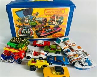 1976 Lesney Matchbox Vinyl Carry Case Filled With Lesney Matchbox Toy Cars - Case Has Some Damage To One Area, Shown In Photos, All Cars In Great Condition and All Are Matchbox, Included Superfast Hellraiser, Superfast Tomaso Pantera, Superfast Police Launch, Superfast Hi-Tailer, Superfast Dodge Challenger, Baja Buggy, Superfast Pontiac Firebird, Superfast Personnel Carrier and Many More