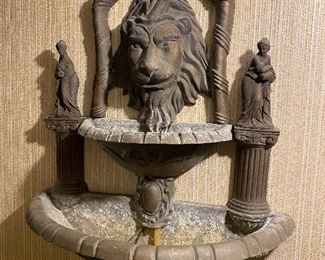 Cool bronze lion wall fountain.