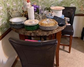 Kitchenette high top table with two stools.