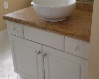 Bath vanity with vessel sink