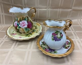 LOT 005- Pair of decorative bowl and pitchers one is 5.5 in and the other is 6.5 in. tall $35