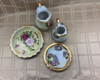 LOT 005- Pair of decorative bowl and pitchers one is 5.5 in and the other is 6.5 in. tall $35