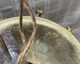 LOT 021- Marked "MADE IN SPAIN" Hollywood regency chandelier in the style of Swarovski AS-IS. There are bent sockets, damage to the metal at the sockets and prism loss. $575 