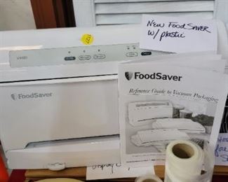 NEW FOOD SAVER W/PLASTIC