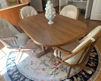 kitchen table and 4 chairs, 1 leaf is in the table