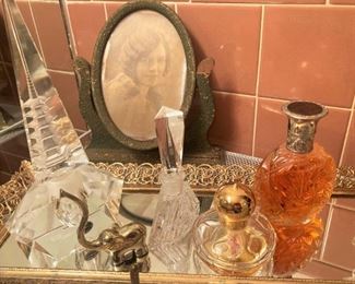Vintage dresser mirror, oval picture frame, and perfume