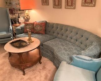 Curved back tufted vintage sofa