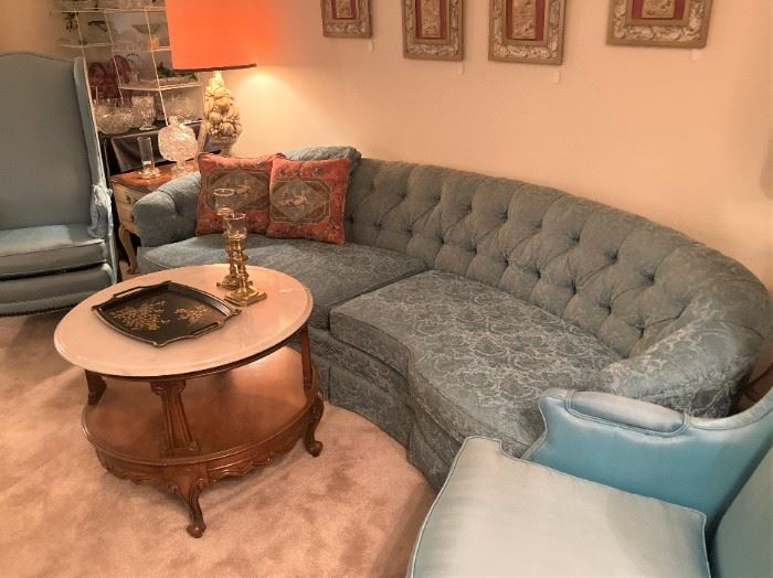 Curved back tufted vintage sofa