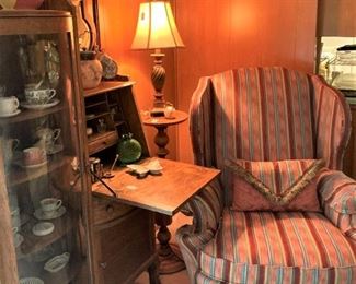 Antique secretary; upholstered wingback chair