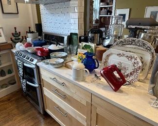 Kitchen appliances, flatware, dishware, and Decor.