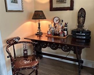 Melodic chair, antique, gothic desk, art deco lamp, art and Bose radio system.