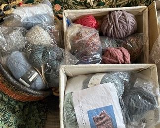 All sorts of yarns and fabrics and textiles and knitting materials and crocheting tools.