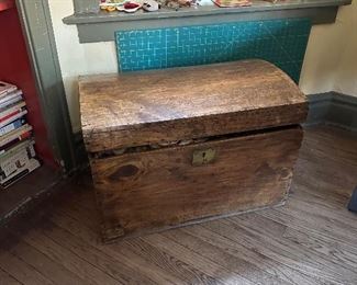 Humpback trunk (filled with barkcloth and textiles).