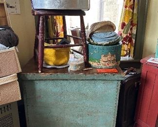 Painted green wooden lidded box. There’s a giant linen laundry bag inside. Also the inside is unpainted.