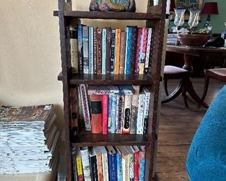 Mission bookcase. Books. Esther Hunt Oriental chalkware.