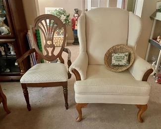 Wooden arm chair and white wing back chair.