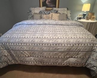 Comfortable king size mattress, and box spring. Beautiful King blue and white bedspread.