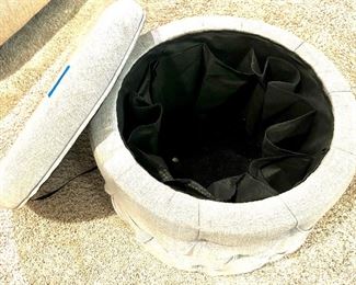 Cream colored upholstered storage, pocketed liner,  footstool $30