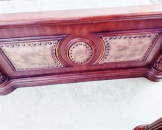 DETAIL OF FOOTBOARD, SUEDE, HOBNAILED, CARVED WOOD