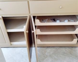 INSIDE THIS CABINET,  SLIDE OUT DRAWERS, TOP CABINETS ARE W/O SHELVES  FOR LARGE ITEMS - LIKE BRAND NEW