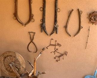 Antique harnesses and spinning wheel