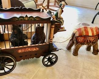 Greatest Show on Earth 
Monkey on elephant pulling animal carrier with 2 bears driven by clown. 