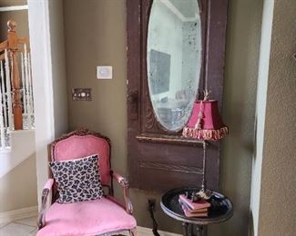 Vintage door, open cabriole armchair, side table, lamp