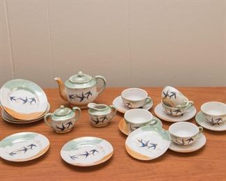 1950's  (stamped Japan) Children's tea set.  6 - 2.5" dish, 6 - cups and saucers, 1 - cream and sugar w/lids & 1 tea pot w/lid:  $140.00