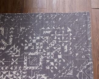 Abstract design rug (5.5' w x 7.5' l):  $90.00