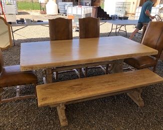 Beautiful wood table with bench and 4 leather chairs 