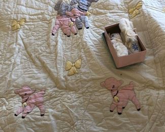 Antique baby quilt and baby moccasins 