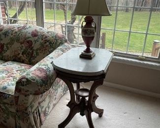 . . . 1800's Victorian marble-topped lamp table with ceramic lamp