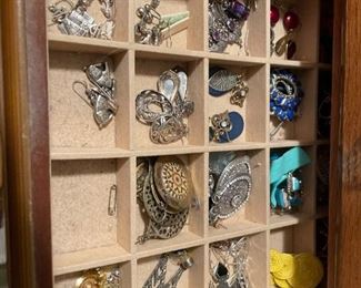 . . . and broaches and ear rings