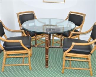 Fabulous McGuire Bamboo 40" Round Dining Table with 4 McGuire Bamboo Arm Chairs, Upholstered in Black Ostrich Vinyl.  Chair Finish is Tiger Crackle.